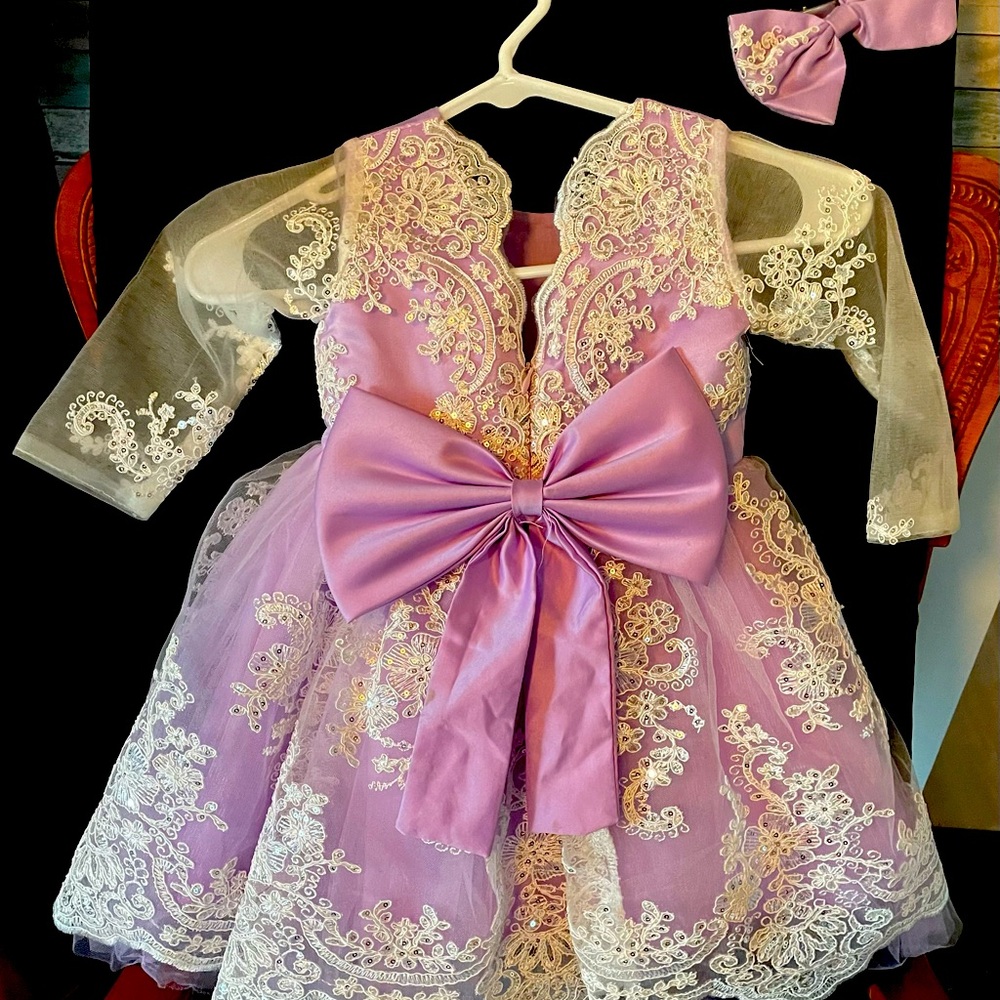 Little flower girl dress worn once for a short time.  Purple under lace